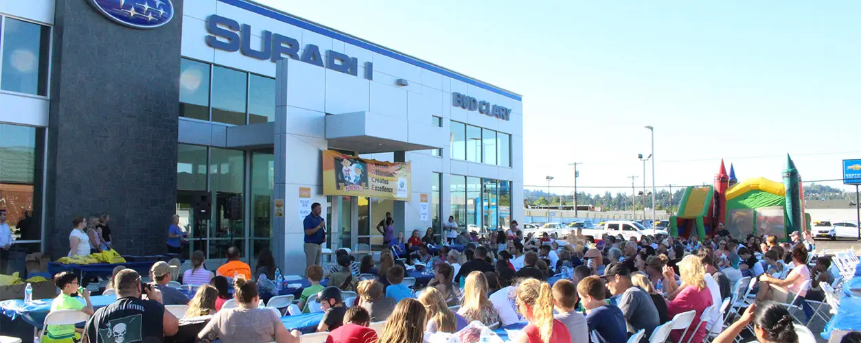 Community event at Bud Clary dealership with families and children
