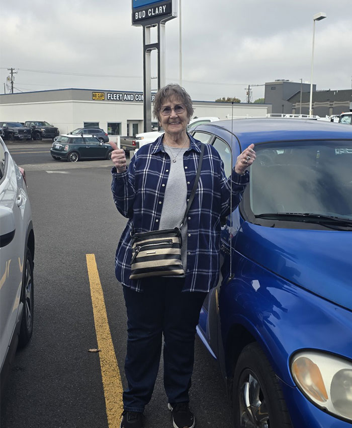 Satisfied customer with their car at Bud Clary